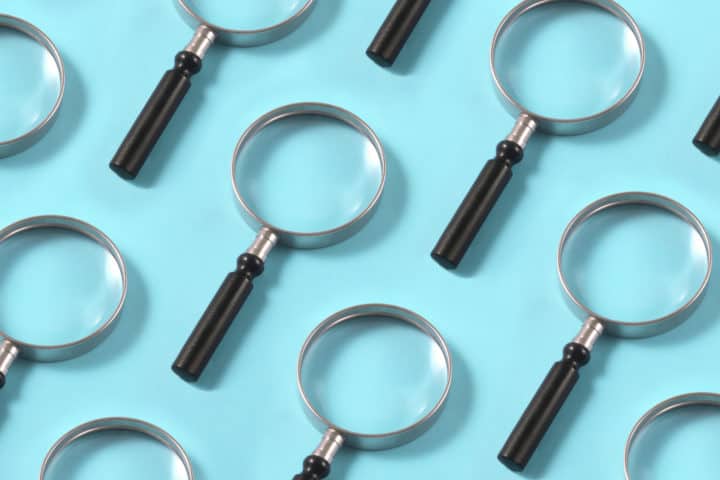 Magnifying Glasses on Blue Background