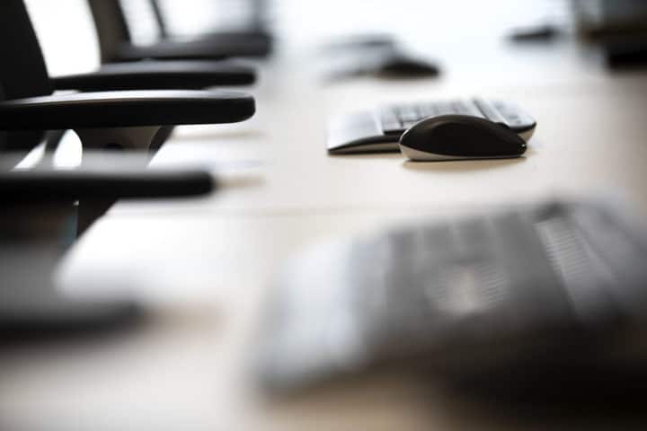 focused shot of a mouse and keyboard on office desk