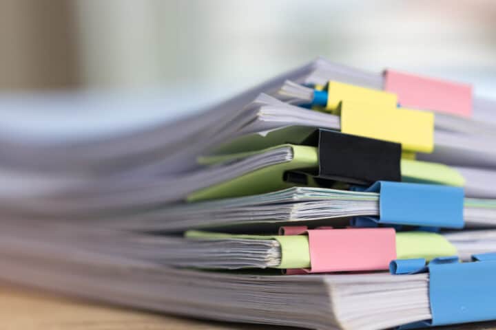 Close up stack of paperwork.