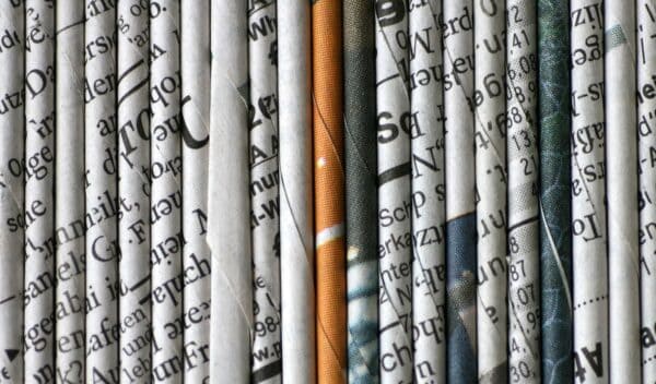 rolled newspaper pages