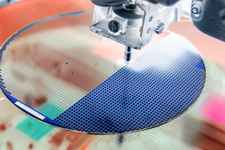 Pick up silicon die in silicon wafer in die attach machine in semiconductor manufacturing/negative color